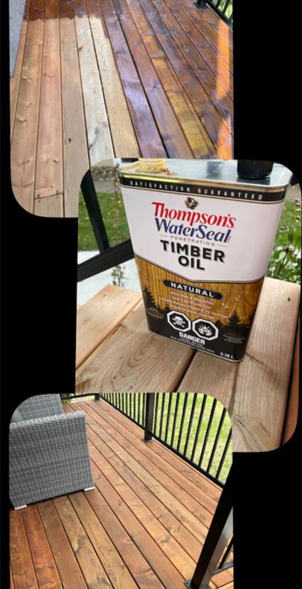 A can of Thompson's WaterSeal Timber Oil on wooden planks outdoors.